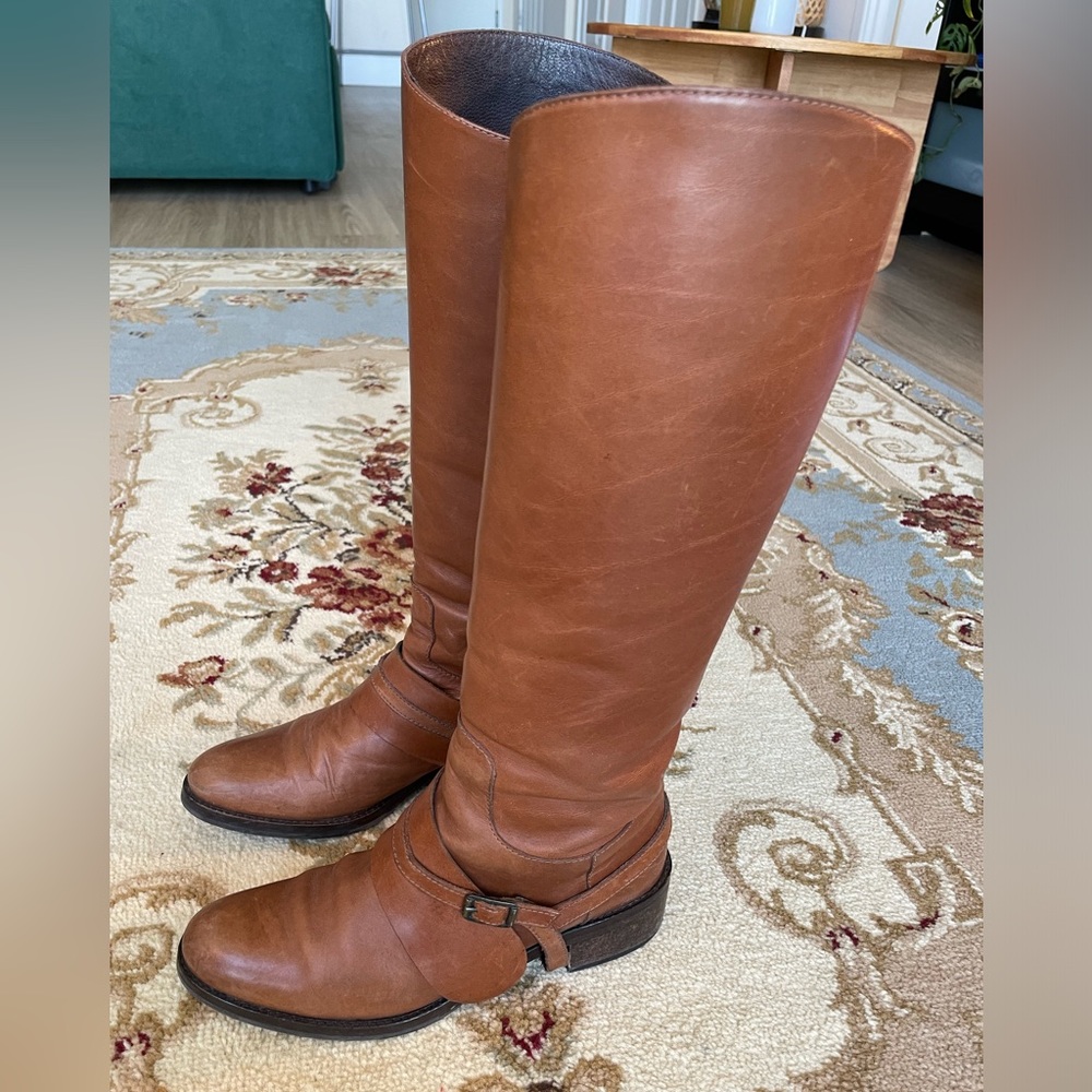Cognac leather cavalières boots.